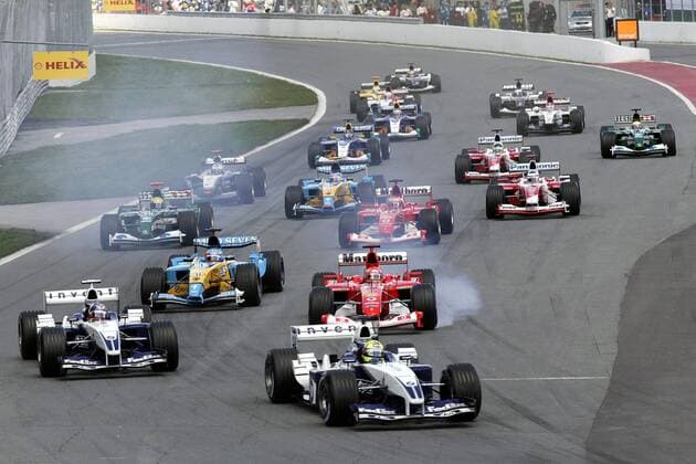 Start GP Kanada 2003: Ralf Schumacher (Deutschland BMW-Williams) führt das Fahrerfeld in die erste Kurve Motorsport Grand Prix Herren Großer Preis von Kanada 2003, Formel 1 Weltmeisterschaft, F1, F, GP, WM, Vdig Totale Montreal