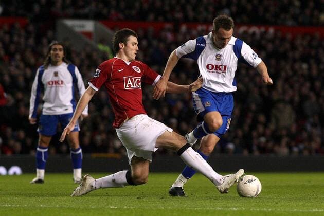 Matthew Taylor (Portsmouth, re.) gegen Michael Carrick (Manchester United) -  Fußball Herren English FA Cup 2006 2007, Englischer Pokal, Pokalspiel, Manchester United - Portsmouth FC Gruppe Manchester Dynamik, Fußball Herren English FA Cup 2006 2007, Englischer Pokal, Pokalspiel, Manchester United - Portsmouth FC Gruppe Manchester Dynamik,