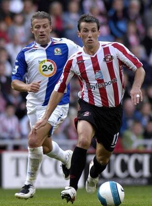 Liam Miller (Sunderland, re.) gegen Tugay Kerimoglu (Blackburn) - EDITORIAL USE ONLY. No use with unauthorised audio, video, data, fixture lists, club league logos or live services. Online in-match use limited to 120 images, no video emulation. No use in betting, games or single club league player publications. Fußball Herren English Premier League 2007 2008, 1. Englische Liga, Sunderland AFC - Blackburn Rovers 1:2 Gruppe Sunderland Dynamik, Fußball Herren English Premier League 2007 2008, 1. Englische Liga, Sunderland AFC - Blackburn Rovers 1:2 Gruppe Sunderland Dynamik,