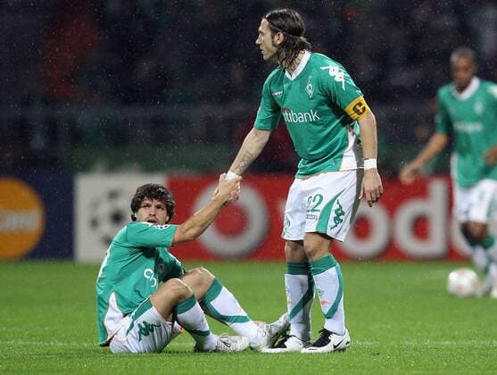 Diego (li.) und Torsten Frings (beide Bremen) im Regen Fußball EC 1 Herren Champions League 2007 2008, SV Werder Bremen Gruppe Bremen Enttäuschung, Fußball EC 1 Herren Champions League 2007 2008, SV Werder Bremen Gruppe Bremen Enttäuschung,