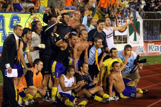 Belgrade, FC Apoel Nikosia team celebrate victory after match and going in next round.From left to right up:Marinos Satsias(2L),Dionysios Chiotis(3L), Strakosha(5L with mustache) goalkeeper coach and Alexandrou Nectarios(6L). From left to right midlle:Savvas Poursaitidis,Christos Kontis and Marcin Zewlakow. From left to right down:Adrian Sikora,Miguel Barbosa Marais Nuno,Michail Chrysostomos and Constantinos Charalambides. :  o0 Totale