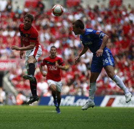 Manchester United s Michael Owen (L) with Chelsea s John Terry - Community Shield EDITORIAL USE ONLY. No use with unauthorised audio, video, data, fixture lists, club league logos or live services. Online in-match use limited to 120 images, no video emulation. No use in betting, games or single club league player publications. o0 FC - ManU