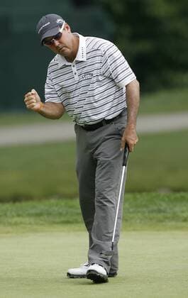 Rich Beem (USA) reacts after sinking a birdie putt on the 17th hole during the PGA Championship  BKX2009081313