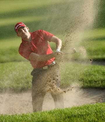 Sergio Garcia of Spain blasts out of a bunker on the 11th hole during the PGA Championship  BKX2009081321
