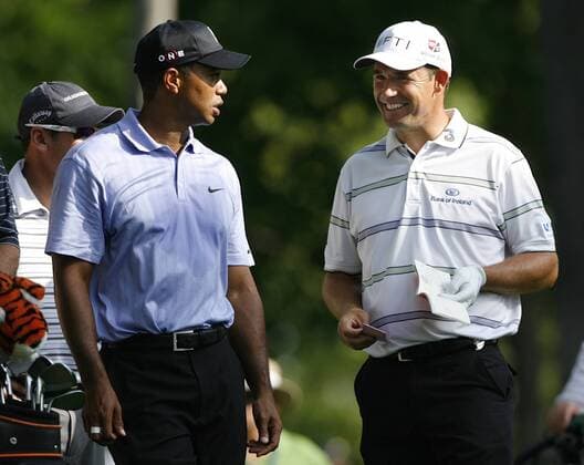 Tiger Woods (USA, L) and Padraig Harrington (IRL) chat as they wait to hit on the 13th hole during the PGA Championship  BKX2009081310 o0 Eldrick