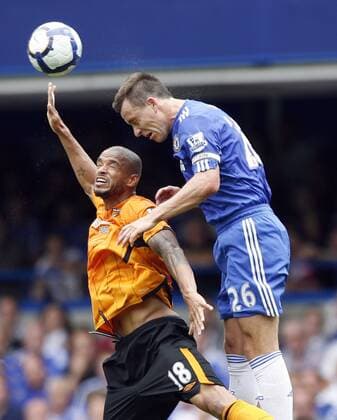 Chelsea s John Terry (R) tussles with Hull s Caleb Folan , Chelsea v Hull City 15th August, 2009 EDITORIAL USE ONLY. No use with unauthorised audio, video, data, fixture lists, club league logos or live services. Online in-match use limited to 120 images, no video emulation. No use in betting, games or single club league player publications. o0 FC