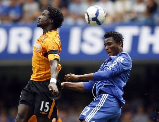 Chelsea s John Obi Mikel (R) tussles with Hull s Bernard Mendy , Chelsea v Hull City 15th August, 2009 EDITORIAL USE ONLY. No use with unauthorised audio, video, data, fixture lists, club league logos or live services. Online in-match use limited to 120 images, no video emulation. No use in betting, games or single club league player publications. o0 FC