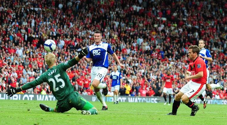 Joe Hart of Birmingham City (li.) saves a shot from Michael Owen of Manchester United - EDITORIAL USE ONLY. No use with unauthorised audio, video, data, fixture lists, club league logos or live services. Online in-match use limited to 120 images, no video emulation. No use in betting, games or single club league player publications. o0 ManU