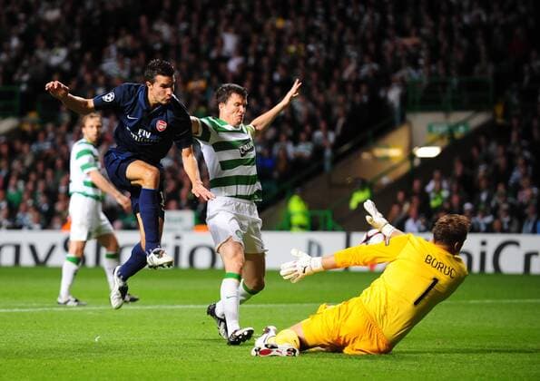 Artur Boruc of Celtic Glasgow (Middle) saves close range from Robin Van Persie of FC Arsenal London - EDITORIAL USE ONLY. No use with unauthorised audio, video, data, fixture lists, club league logos or live services. Online in-match use limited to 120 images, no video emulation. No use in betting, games or single club league player publications.