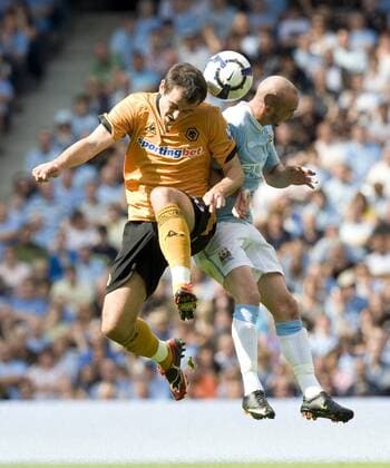 Nenad Milijas (L) of Wolverhampton Wanderers challenges Stephen Ireland of Manchester City EDITORIAL USE ONLY. No use with unauthorised audio, video, data, fixture lists, club league logos or live services. Online in-match use limited to 120 images, no video emulation. No use in betting, games or single club league player publications.
