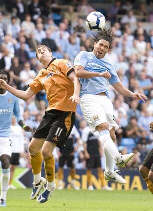 Carlos Tevez (R) of Manchester City and Stephen Ward of Wolverhampton Wanderers EDITORIAL USE ONLY. No use with unauthorised audio, video, data, fixture lists, club league logos or live services. Online in-match use limited to 120 images, no video emulation. No use in betting, games or single club league player publications.