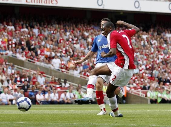FC Arsenal London s Abou Diaby (R) scoring his second goal EDITORIAL USE ONLY. No use with unauthorised audio, video, data, fixture lists, club league logos or live services. Online in-match use limited to 120 images, no video emulation. No use in betting, games or single club league player publications.