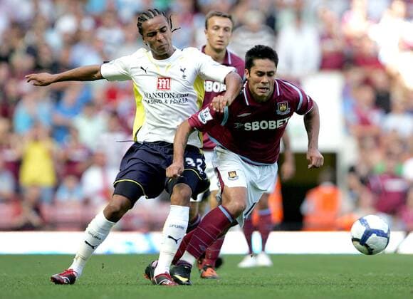 Luis Jimenez of West Ham United (R) holds off Benoit Assou-Ekotto of Tottenham Hotspur West Ham United v Tottenham Hotspur Hotspurs Spurs EDITORIAL USE ONLY. No use with unauthorised audio, video, data, fixture lists, club league logos or live services. Online in-match use limited to 120 images, no video emulation. No use in betting, games or single club league player publications.