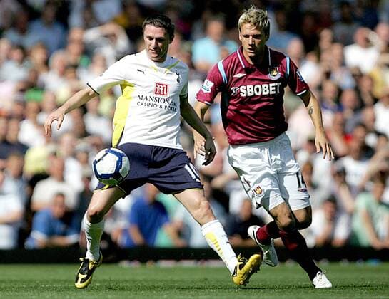 Robbie Keane of Tottenham Hotspur (L) holds off Radoslav Kovac of West Ham United West Ham United v Tottenham Hotspur Hotspurs Spurs EDITORIAL USE ONLY. No use with unauthorised audio, video, data, fixture lists, club league logos or live services. Online in-match use limited to 120 images, no video emulation. No use in betting, games or single club league player publications.