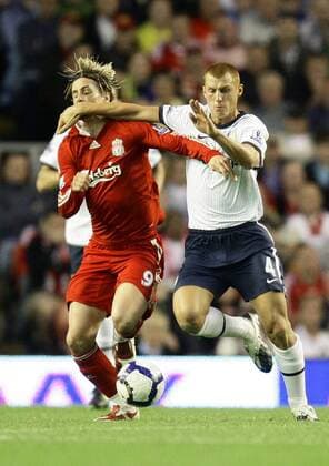 Fernando Torres (L) of Liverpool gets one in the face from Steve Sidwell of Aston Villa EDITORIAL USE ONLY. No use with unauthorised audio, video, data, fixture lists, club league logos or live services. Online in-match use limited to 120 images, no video emulation. No use in betting, games or single club league player publications. o0 FC