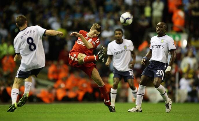Steven Gerrard (Liverpool, red) vs Aston Villa EDITORIAL USE ONLY. No use with unauthorised audio, video, data, fixture lists, club league logos or live services. Online in-match use limited to 120 images, no video emulation. No use in betting, games or single club league player publications. o0 FC