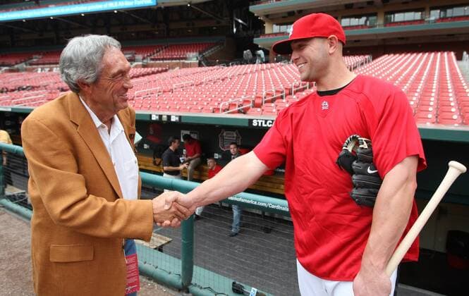 Legenary college coach Eddie Sutton (L) shakes hands with St. Louis Cardinals Matt Holliday  SLP2009082807