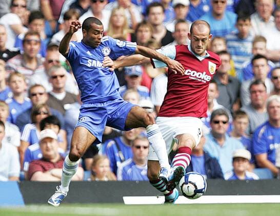 Ashley Cole of Chelsea tackles Steven Fletcher of Burnley Barclays Premier League Chelsea v Burnley 29th August, 2009 EDITORIAL USE ONLY. No use with unauthorised audio, video, data, fixture lists, club league logos or live services. Online in-match use limited to 120 images, no video emulation. No use in betting, games or single club league player publications.