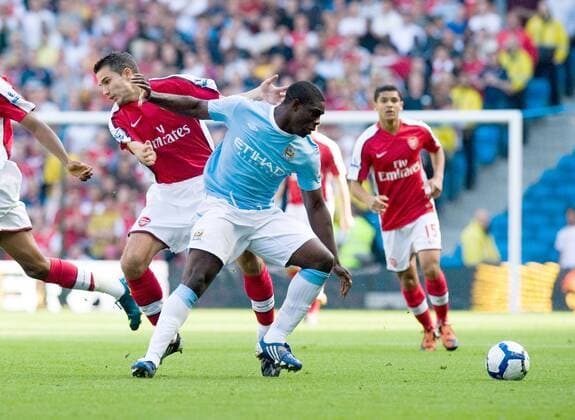 Micah Richards of Manchester City (r.) pushes away Robin Van Persie of Arsenal London, Barclays Premier League Manchester City v Arsenal 12th September, 2009 EDITORIAL USE ONLY. No use with unauthorised audio, video, data, fixture lists, club league logos or live services. Online in-match use limited to 120 images, no video emulation. No use in betting, games or single club league player publications.