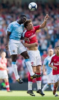 Nicklas Bendtner of Arsenal London (r.) challenges Kolo Toure of Manchester City Barclays Premier League Manchester City v Arsenal 12th September, 2009 EDITORIAL USE ONLY. No use with unauthorised audio, video, data, fixture lists, club league logos or live services. Online in-match use limited to 120 images, no video emulation. No use in betting, games or single club league player publications.