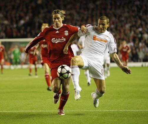 FC Liverpool s Fernando Torres (L) tussles with Debrecen s Laszio Bodnar - EDITORIAL USE ONLY. No use with unauthorised audio, video, data, fixture lists, club league logos or live services. Online in-match use limited to 120 images, no video emulation. No use in betting, games or single club league player publications. Debreceni VSC, DVSC