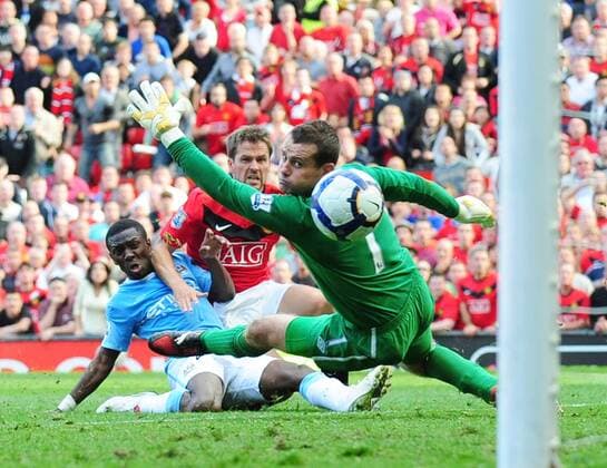 Michael Owen (M) of Manchester United scores the winning goal past Shay Given of Manchester City - EDITORIAL USE ONLY. No use with unauthorised audio, video, data, fixture lists, club league logos or live services. Online in-match use limited to 120 images, no video emulation. No use in betting, games or single club league player publications.