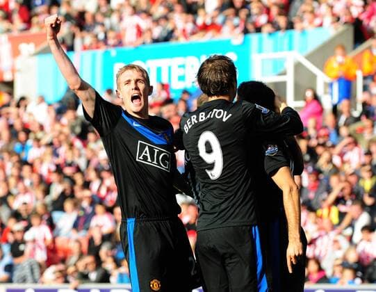Darren Fletcher of Manchester United (L) celebrates Dimitar Berbatov of Manchester United (9) goal -- Barclays Premier League Stoke City v Manchester United 26th September, 2009 EDITORIAL USE ONLY. No use with unauthorised audio, video, data, fixture lists, club league logos or live services. Online in-match use limited to 120 images, no video emulation. No use in betting, games or single club league player publications. o0 Jubel Freude