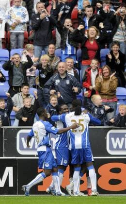 Wigan celebrate after Hugo Rodallega (C) puts them back ahead from the penalty spot. EDITORIAL USE ONLY. No use with unauthorised audio, video, data, fixture lists, club league logos or live services. Online in-match use limited to 120 images, no video emulation. No use in betting, games or single club league player publications. o0 Athletic