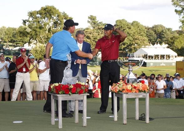 Phil Mickelson (l.) and Tiger Woods (both USA) shake hands at the trophy presentation in the final round of the FedEx Cup in Atlanta. Mickelson won The Tour Championship finishing at 9 under. Woods won the Fed Ex Cup - Icon4880909270625 EDITORIAL USE ONLY