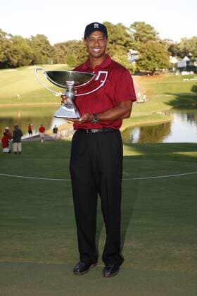 Tiger Woods (USA) stands with his Fed Ex trophy in the final round of the FedEx Cup 2009 in Atlant - . Icon4880909270629 EDITORIAL USE ONLY