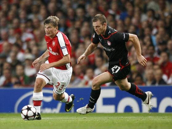 Arsenal s Andrei Arshavin (l.) past Olympiacos Avraam Papadopolous - EDITORIAL USE ONLY. No use with unauthorised audio, video, data, fixture lists, club league logos or live services. Online in-match use limited to 120 images, no video emulation. No use in betting, games or single club league player publications. o0 Arsenal FC London - Olympiakos Piräus