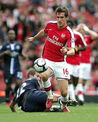 Aaron Ramsey (r.) of Arsenal FC London beats Morten Gamst Pedersen of Blackburn Rovers to the ball EDITORIAL USE ONLY. No use with unauthorised audio, video, data, fixture lists, club league logos or live services. Online in-match use limited to 120 images, no video emulation. No use in betting, games or single club league player publications.