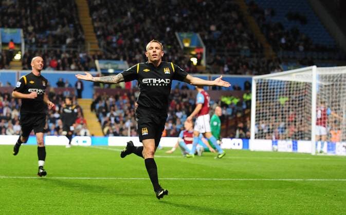 Craig Bellamy of Manchester City celebrates - EDITORIAL USE ONLY. No use with unauthorised audio, video, data, fixture lists, club league logos or live services. Online in-match use limited to 120 images, no video emulation. No use in betting, games or single club league player publications. o0 Birmingham