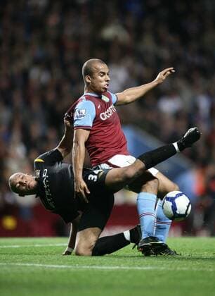 Gabriel Agbonlahor (R) of Aston Villa and Nigel De Jong of Manchester City - EDITORIAL USE ONLY. No use with unauthorised audio, video, data, fixture lists, club league logos or live services. Online in-match use limited to 120 images, no video emulation. No use in betting, games or single club league player publications. o0 Birmingham o00 Kampf