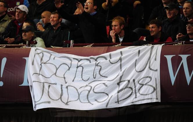 Aston Villa fans with a flag calling Gareth Barry of Manchester City judas - EDITORIAL USE ONLY. No use with unauthorised audio, video, data, fixture lists, club league logos or live services. Online in-match use limited to 120 images, no video emulation. No use in betting, games or single club league player publications. o0 Birmingham o00 Plakat