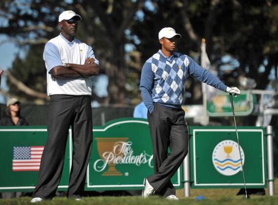 Tiger Woods (R) stands next to basketball legend Michael Jordan (both USA) as he waits to hit off of the 15th tee during a practice round prior to the start of The Presidents Cup in San Francisco, California -  SFP20091007301 o00 The President s