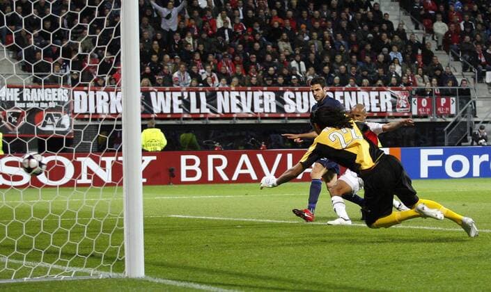 Arsenal London s Cesc Fabregas (l.) scoring his sides opening goal against AZ Alkmaar - EDITORIAL USE ONLY. No use with unauthorised audio, video, data, fixture lists, club league logos or live services. Online in-match use limited to 120 images, no video emulation. No use in betting, games or single club league player publications.