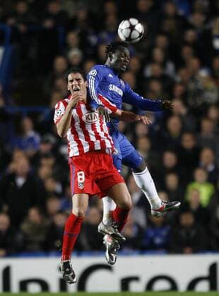 Chelsea s Michael Essien (R) tussles with Atletico Madrid s Raul Garcia EDITORIAL USE ONLY. No use with unauthorised audio, video, data, fixture lists, club league logos or live services. Online in-match use limited to 120 images, no video emulation. No use in betting, games or single club league player publications.