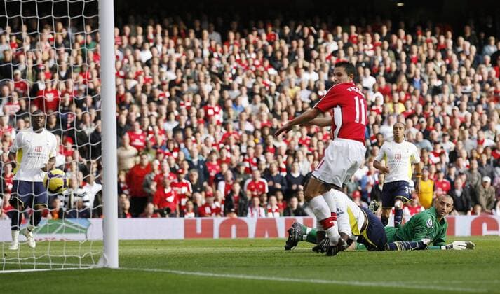 Arsenal s Robin Van Persie (red) scoring his sides third goal - EDITORIAL USE ONLY. No use with unauthorised audio, video, data, fixture lists, club league logos or live services. Online in-match use limited to 120 images, no video emulation. No use in betting, games or single club league player publications. o0 Tottenham Hotspur, Hotspurs, Spurs, FC London