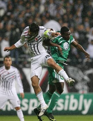 Besiktas Istanbul - VfL Wolfsburg, Ibrahim Uzulmez (L) of Besiktas and Obafemi Martins (R) of Wolfsburg. 