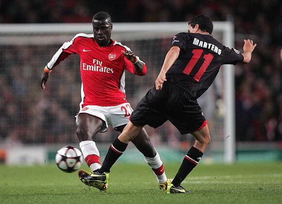 Emmanuel Eboue (L) of Arsenal is tackled by Maarten Martens of AZ Alkmaar - Arsenal FC London - AZ Alkmaar - EDITORIAL USE ONLY. No use with unauthorised audio, video, data, fixture lists, club league logos or live services. Online in-match use limited to 120 images, no video emulation. No use in betting, games or single club league player publications.