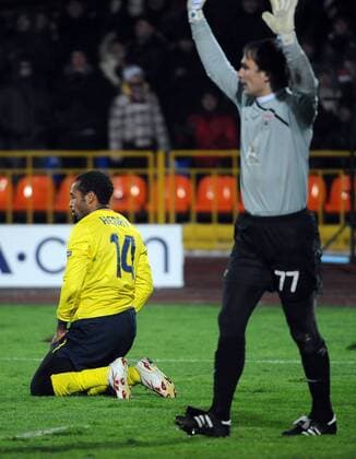 FC Barcelona s Thierry Henry (L) and Rubin Kazan s goalkeeper Sergei Ryzhikov  Premiumd TASS_1055268