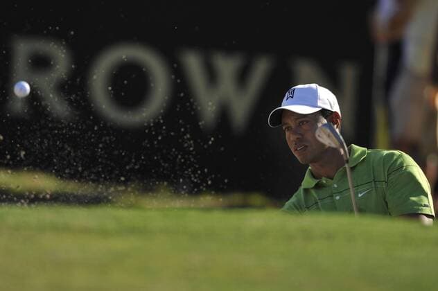 TIGER WOODS (USA) practices in the bunker on the 11th. - ZUMAmm5