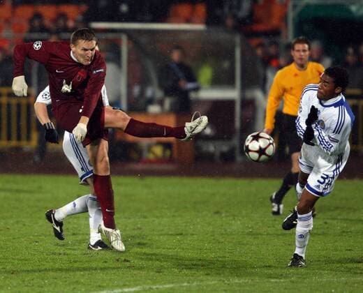152: KAZAN, TATARSTAN, RUSSIA. NOVEMBER 24, 2009. Rubin s Alexander Bukharov and Dynamo s Betao (foreground L-R) in action during their Champions League match Rubin Kazan vs. Dynamo Kyiv.  RE0C301C