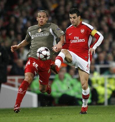 Arsenal s Cesc Fabregas (r.) tussles with Liege s Axel Witsel Champions League Group H FC Arsenal v Standard Liege Lüttich 24th November, 2009 EDITORIAL USE ONLY. No use with unauthorised audio, video, data, fixture lists, club league logos or live services. Online in-match use limited to 120 images, no video emulation. No use in betting, games or single club league player publications.