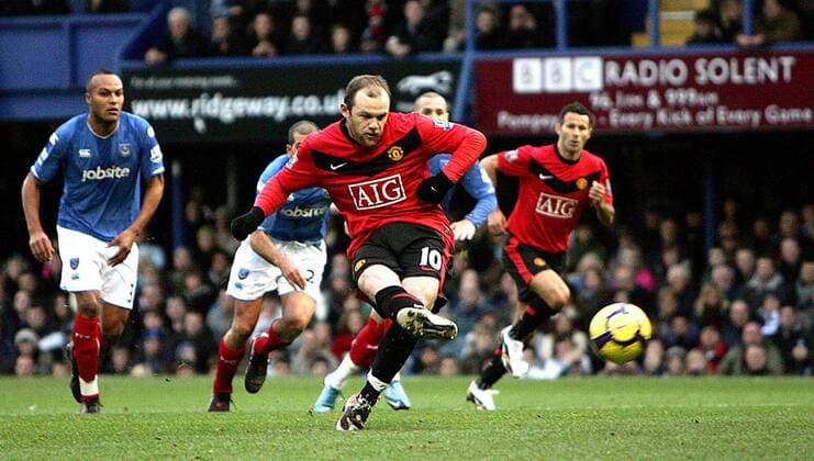 Wayne Rooney of Manchester United scores his side s first goal from the penalty spot Barclays Premier League Portsmouth FC v Manchester United 28th November, 2009 EDITORIAL USE ONLY. No use with unauthorised audio, video, data, fixture lists, club league logos or live services. Online in-match use limited to 120 images, no video emulation. No use in betting, games or single club league player publications.