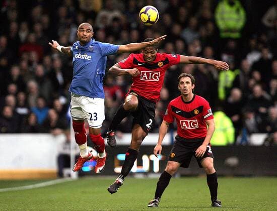Kevin-Prince Boateng (L) of Portsmouth and Luis Antonio Valencia of Manchester United leap for the ball Barclays Premier League Portsmouth FC v Manchester United 28th November, 2009 EDITORIAL USE ONLY. No use with unauthorised audio, video, data, fixture lists, club league logos or live services. Online in-match use limited to 120 images, no video emulation. No use in betting, games or single club league player publications.