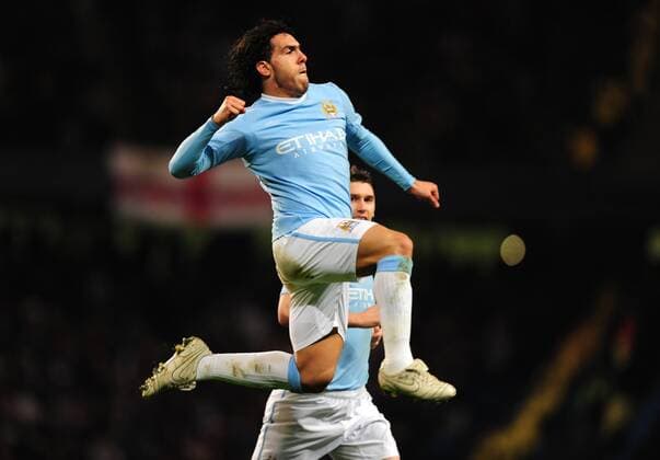 Carlos Tevez of Manchester City celebrates scoring the first goal - Manchester City - FC Arsenal London - EDITORIAL USE ONLY. No use with unauthorised audio, video, data, fixture lists, club league logos or live services. Online in-match use limited to 120 images, no video emulation. No use in betting, games or single club league player publications. o0 Jubel, Freude