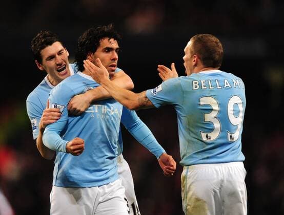 Carlos Tevez (C) of Manchester City celebrates scoring the first goal - Manchester City - FC Arsenal London - EDITORIAL USE ONLY. No use with unauthorised audio, video, data, fixture lists, club league logos or live services. Online in-match use limited to 120 images, no video emulation. No use in betting, games or single club league player publications. o0 Jubel, Freude