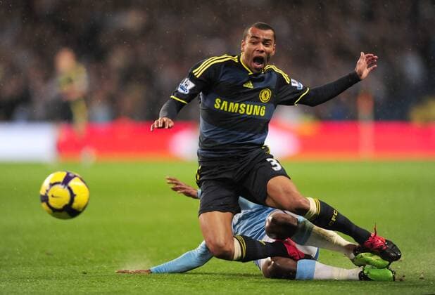 Ashley Cole of Chelsea FC London (L) is brought down by Shaun Wright Phillips of Manchester City Barclays Premier League Manchester City v Chelsea 5th December, 2009 EDITORIAL USE ONLY. No use with unauthorised audio, video, data, fixture lists, club league logos or live services. Online in-match use limited to 120 images, no video emulation. No use in betting, games or single club league player publications.